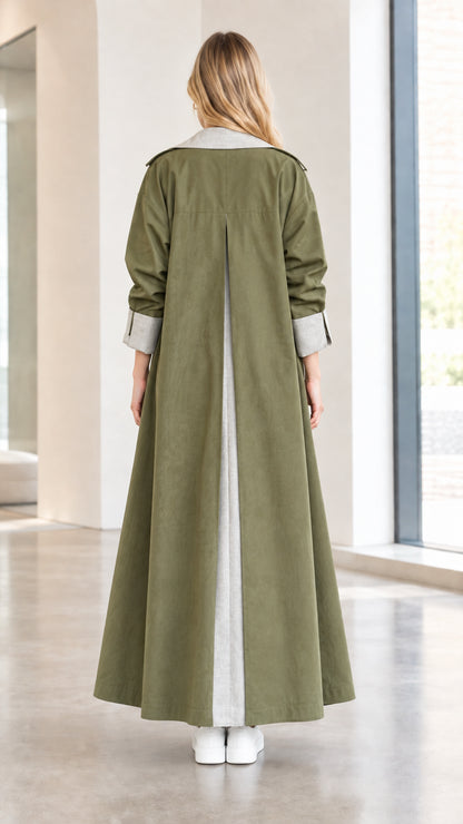 Back view of olive green maxi trench coat highlighting the inverted contrast back pleat