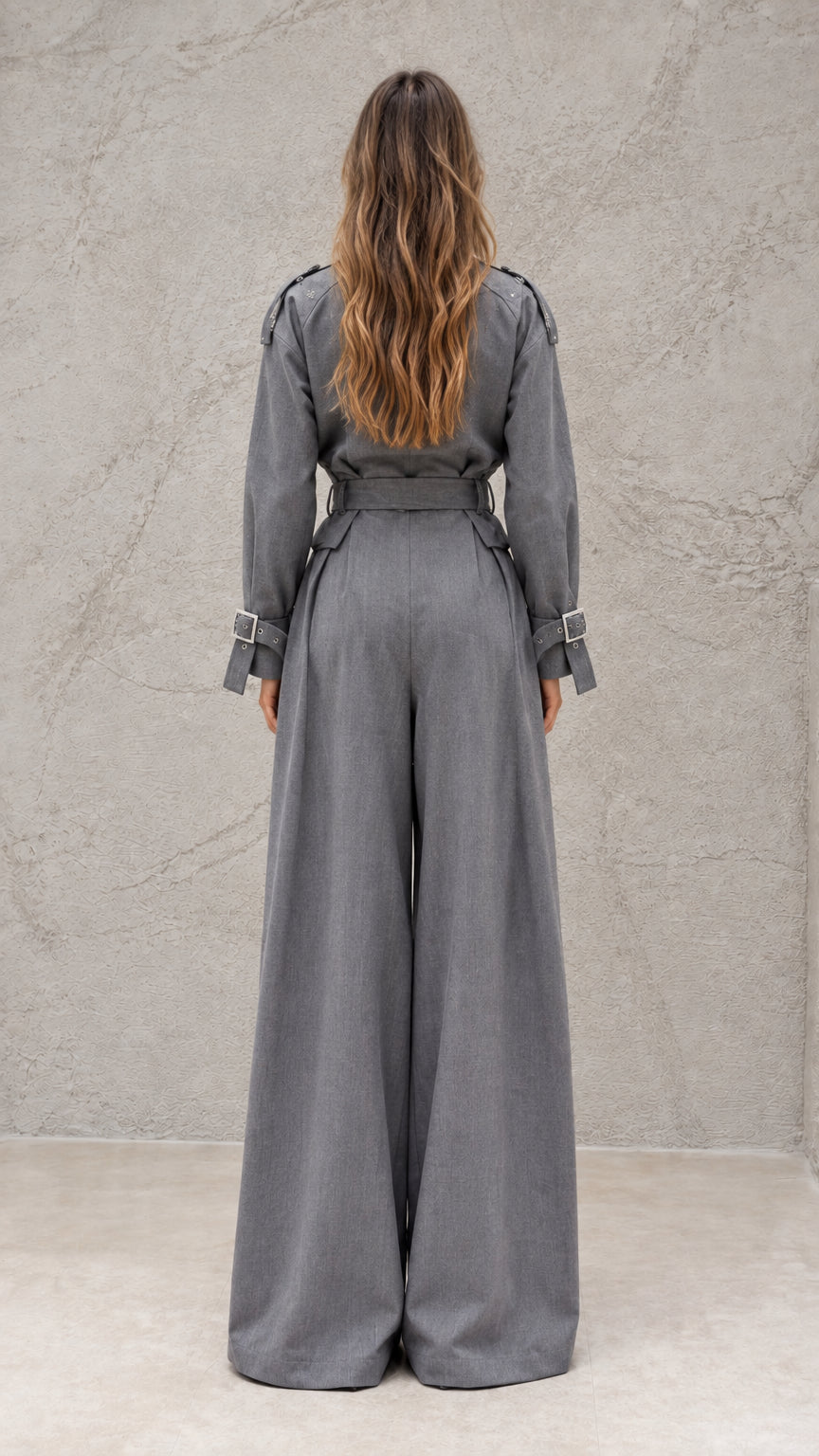 Back view of model wearing grey tailored wide-leg jumpsuit