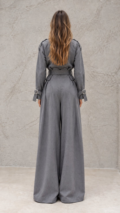 Back view of model wearing grey tailored wide-leg jumpsuit