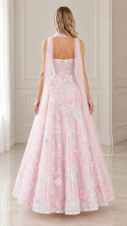 Back view of pink strapless sequin gown showing trailing sheer scarf drape