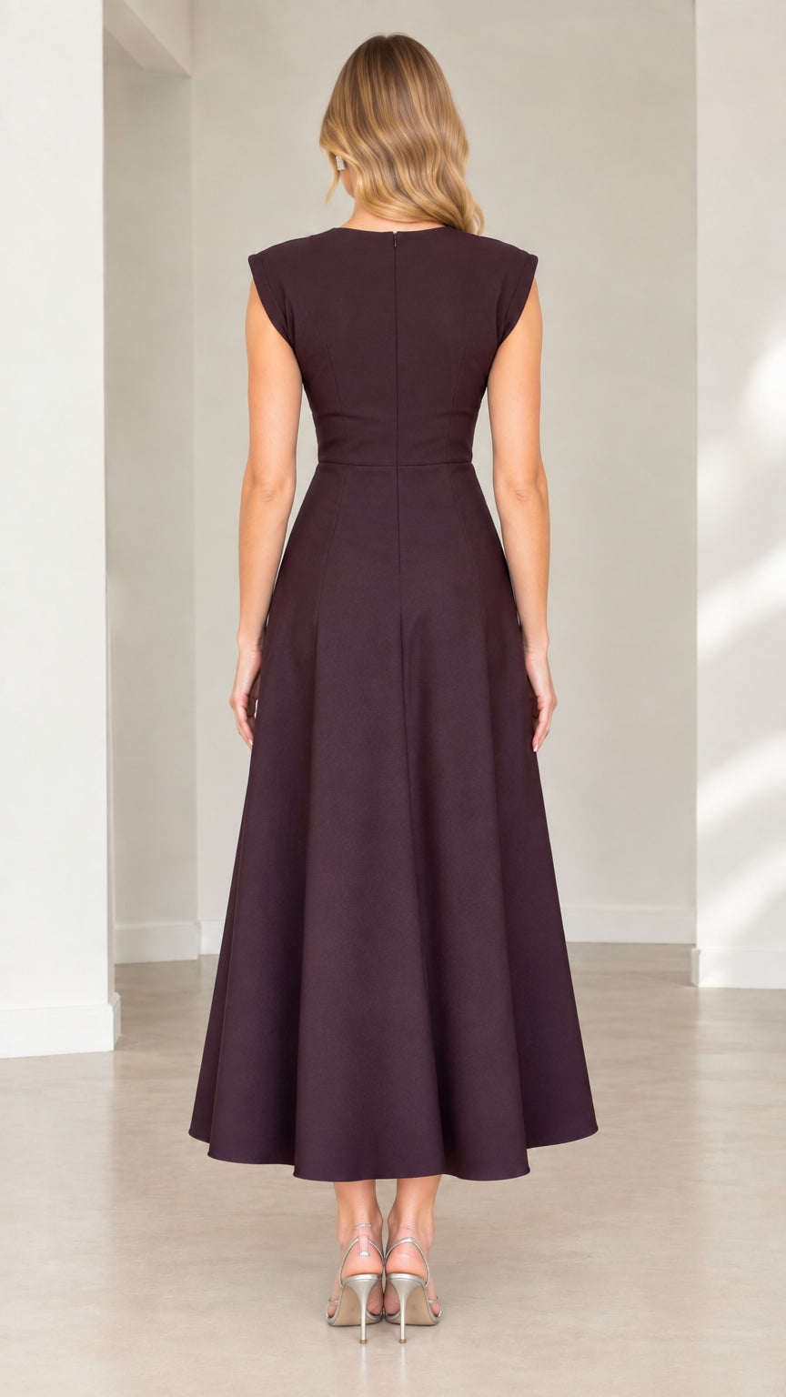 Back view of plum cap sleeve midi dress showing clean tailored lines and zipper closure