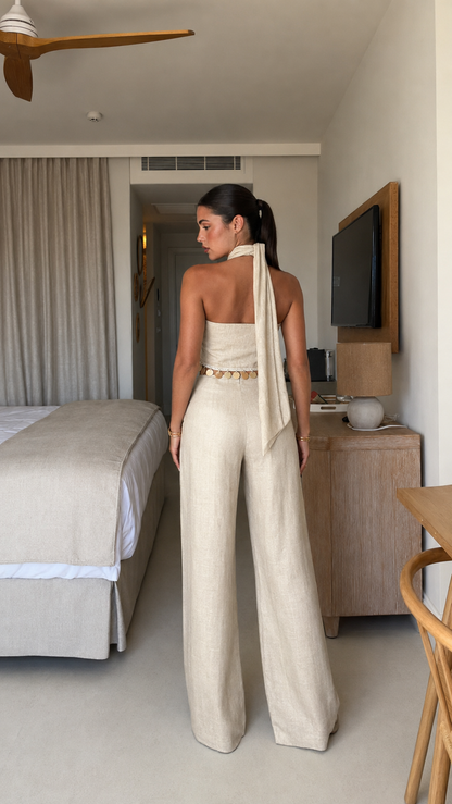 Back view of cream open-back halter wide-leg jumpsuit