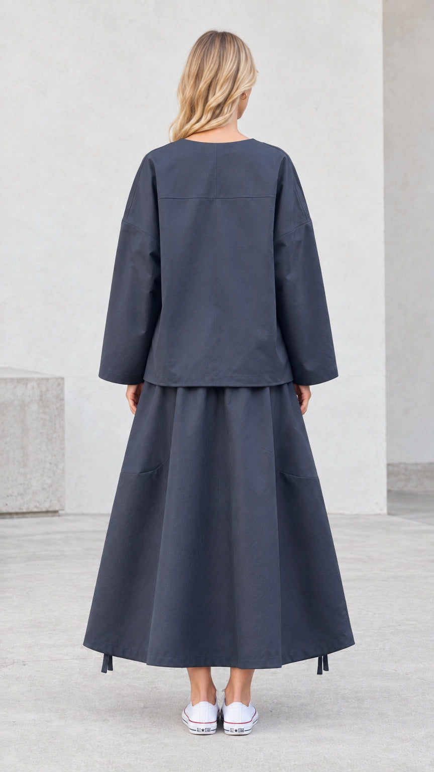 Back view of charcoal grey relaxed two-piece maxi skirt set