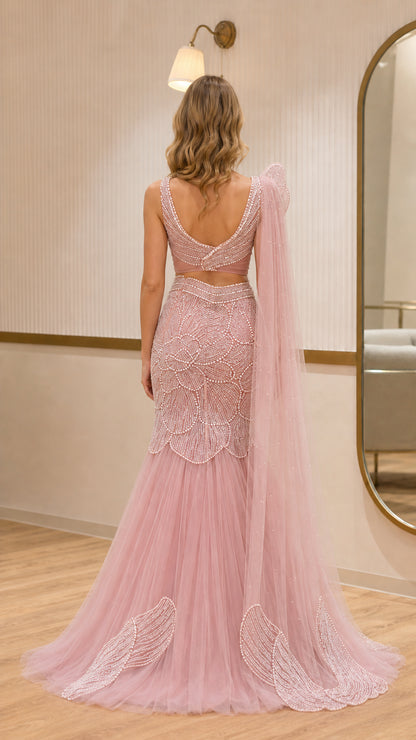 Back view of dusty pink two-piece formal gown with back scoop neck and tulle train