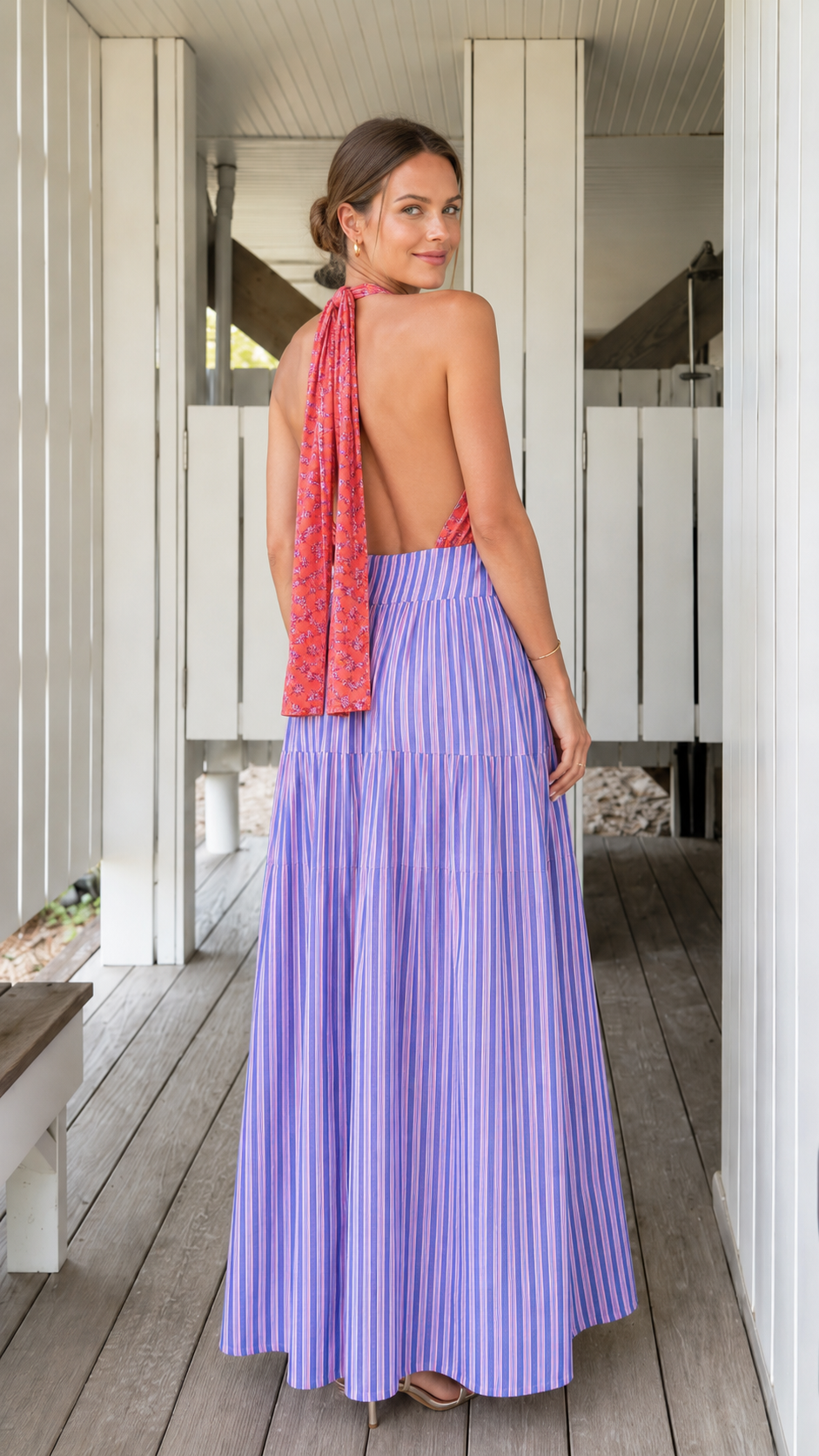 Back view of coral and lavender halter maxi dress with long tie detail