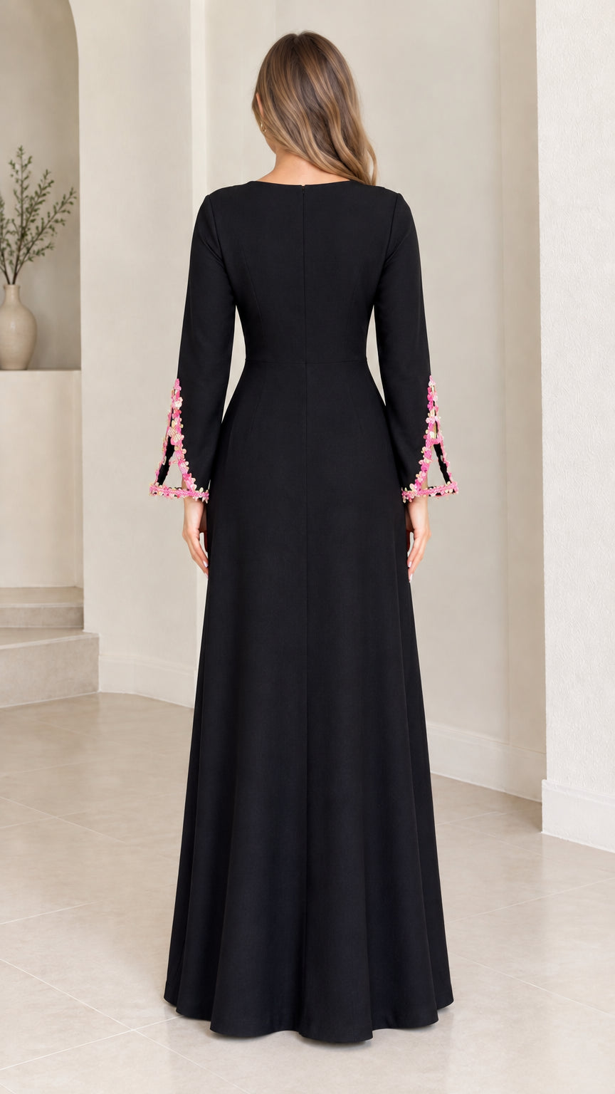 Back view of black long sleeve formal maxi dress