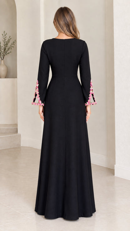 Back view of black long sleeve formal maxi dress