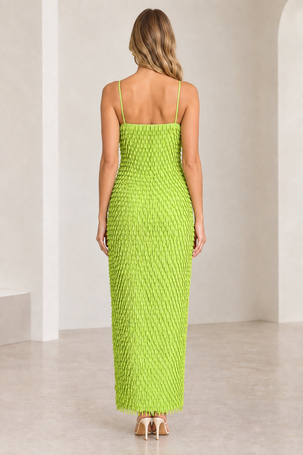 Back view of woman wearing Lime Green textured fringe cami maxi dress