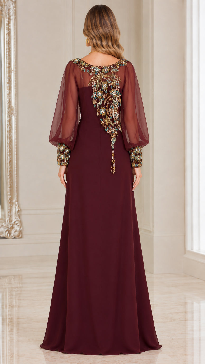 Back view of burgundy formal dress showing sheer sleeve and back embroidery details