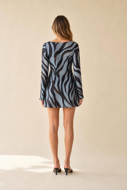 Back view of model showcasing mini dress length and fit
