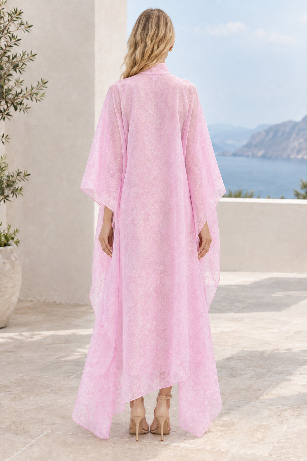 Back view of Blush Pink draped mock neck maxi cape dress