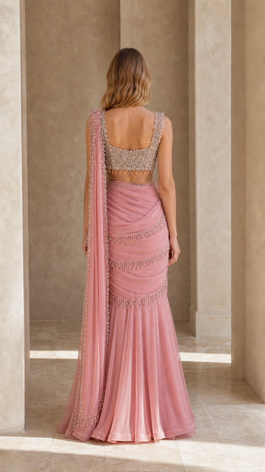 Back view of dusty pink formal gown showing square back and cascading drape