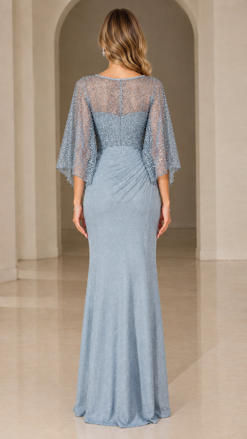 Back view of dusty blue sequined evening gown with capelet flutter sleeves