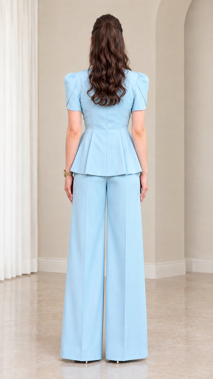 Back view of model in Sky Blue peplum two-piece pant suit
