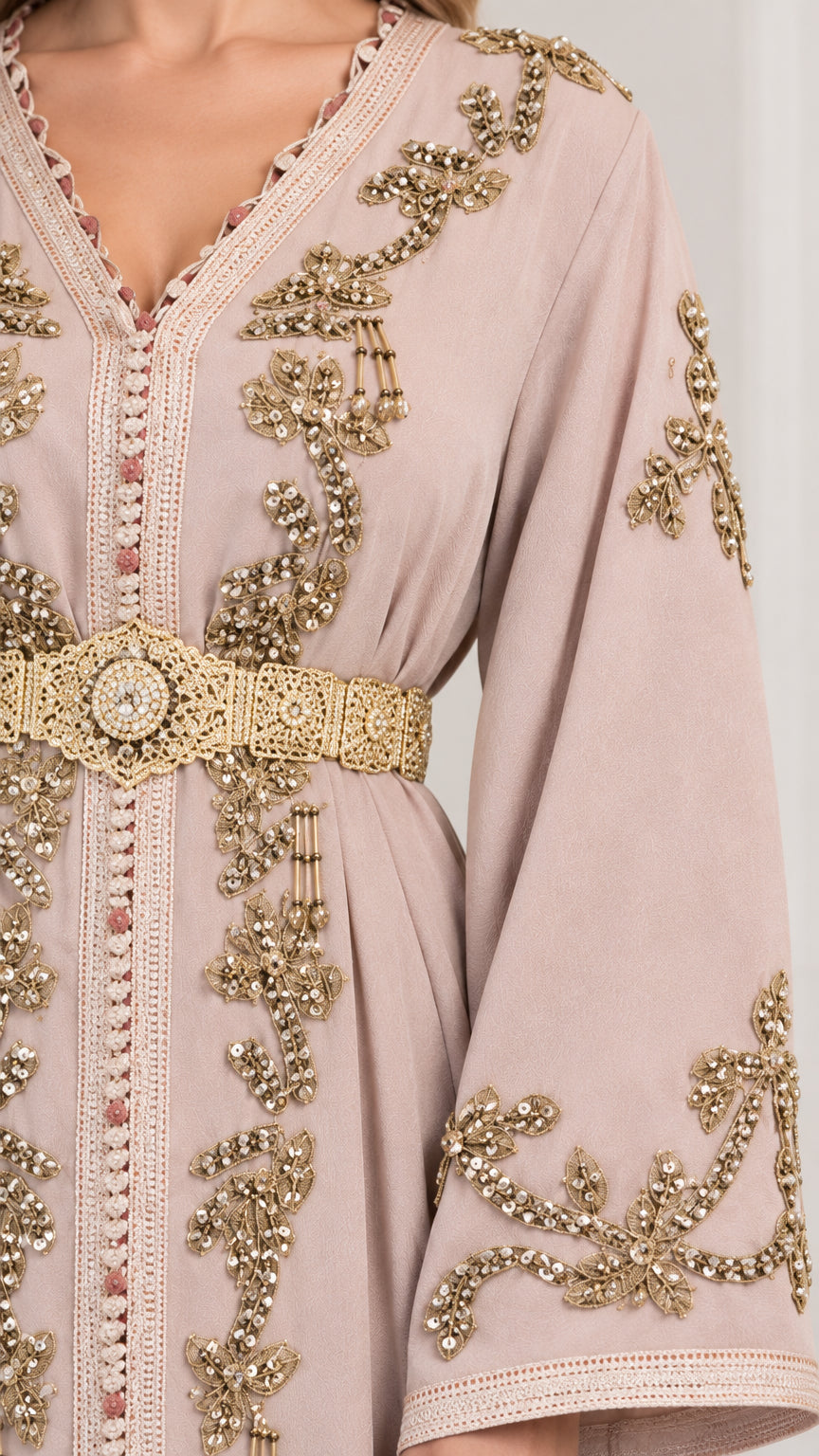 Close-up detail of ornate gold embroidery and metallic waist belt on Dusty Pink kaftan