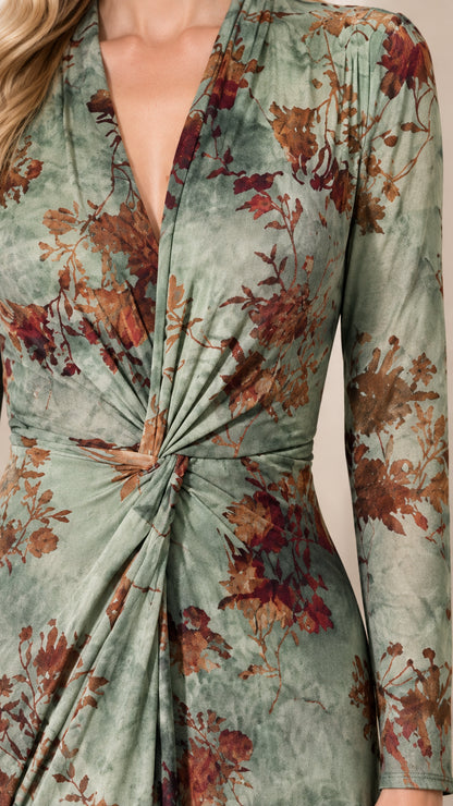 Close-up detail of twisted knot waist and V-neckline on sage green floral dress