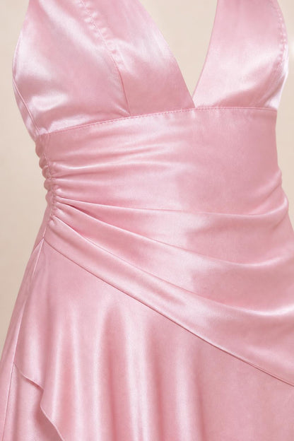 Close-up of side ruching and bodice detail on pink satin dress