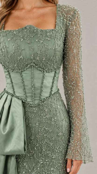 Close-up of square neckline and beaded corset boning detail on sage green formal dress