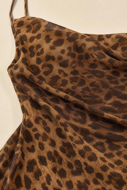 Close-up texture view of brown leopard print fabric and cowl neckline