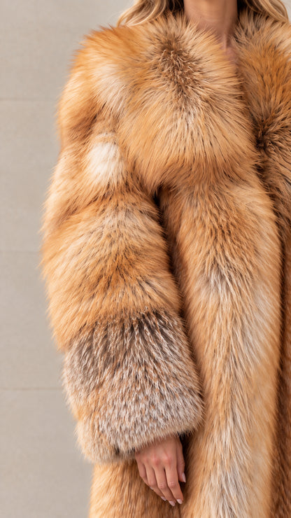 Close-up detail of plush honey brown faux fur texture and wide cuff sleeve