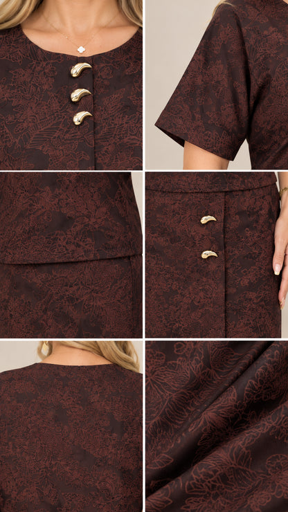 Close-up details of gold-tone hardware, round neckline, and jacquard fabric texture