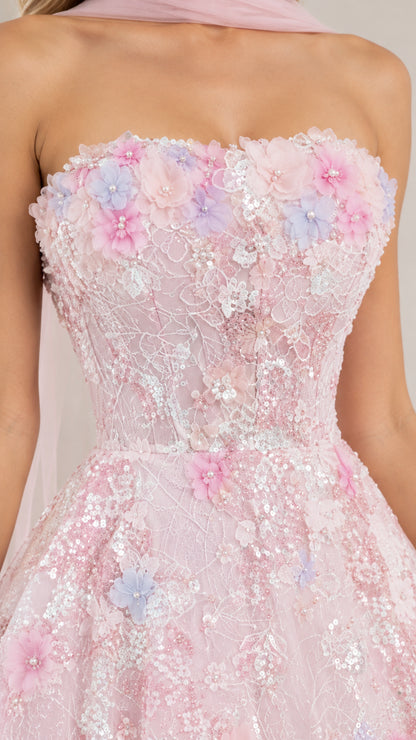 Close-up of pink bodice detailed with 3D floral appliqués and glittering sequins