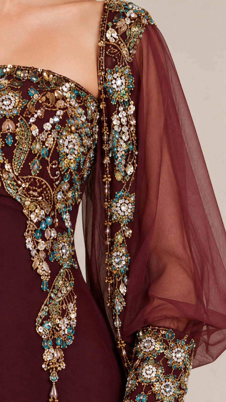 Close-up detail of intricate beadwork, crystal embroidery, and sheer sleeve cuff