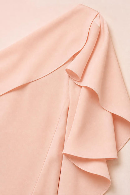 Close-up detail of the layered ruffle sleeve on the peach dress