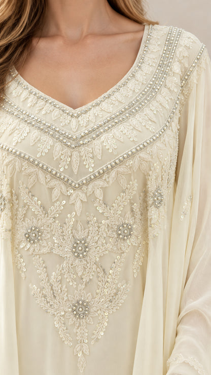 Close-up of intricate sequin and bead embroidery on V-neck bodice