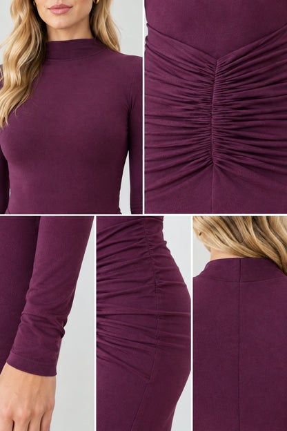 Close-up details of neckline, waist ruching, and sleeve craftsmanship on Plum dress