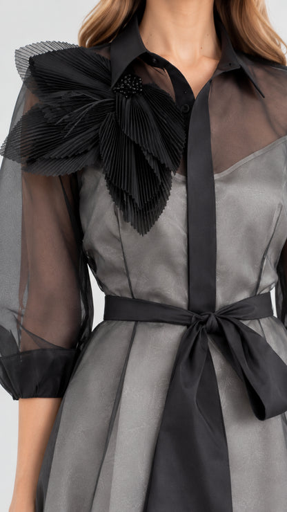 Close-up detail of the collar, pleated 3D shoulder bloom, and tie sash on Charcoal Grey dress