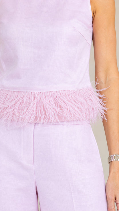 Close-up detail of lilac top featuring delicate feather fringe hem