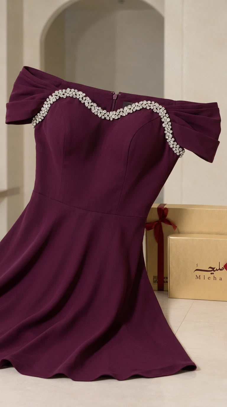 Close-up detail of rhinestone-embellished sweetheart neckline and bodice in burgundy