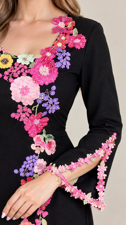 Close-up of neckline and cuff 3D floral embroidery detail