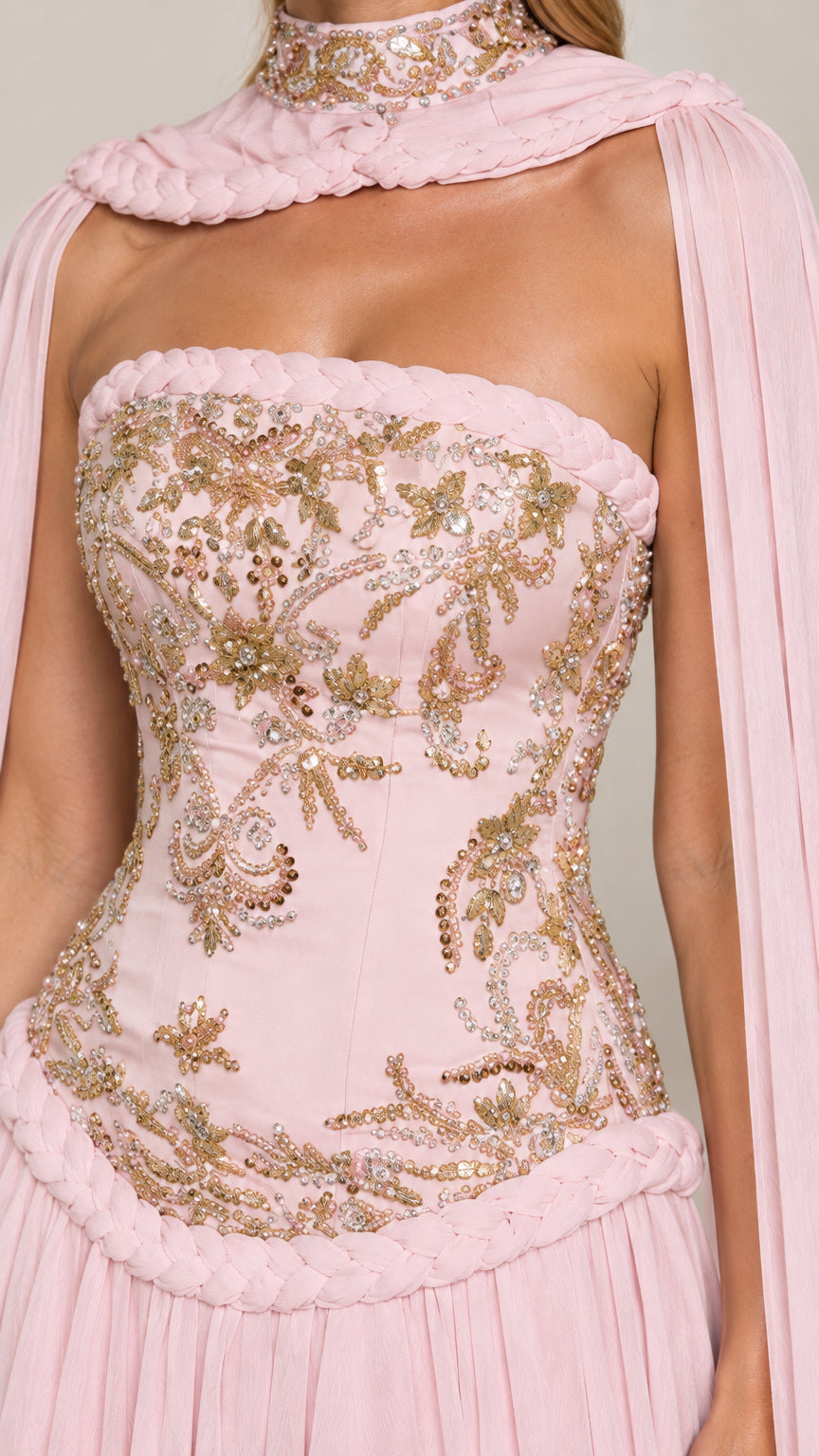 Close-up of gold beaded embroidery and braided waist detail on blush pink corset
