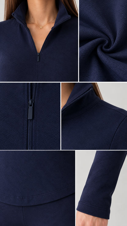 Close-up details of navy blue half-zip collar, zipper pull, and soft knit fabric texture