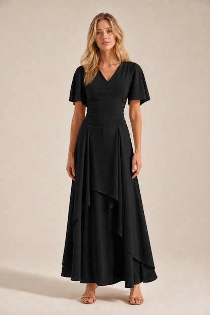 Front view of model wearing black V-neck flutter sleeve maxi dress