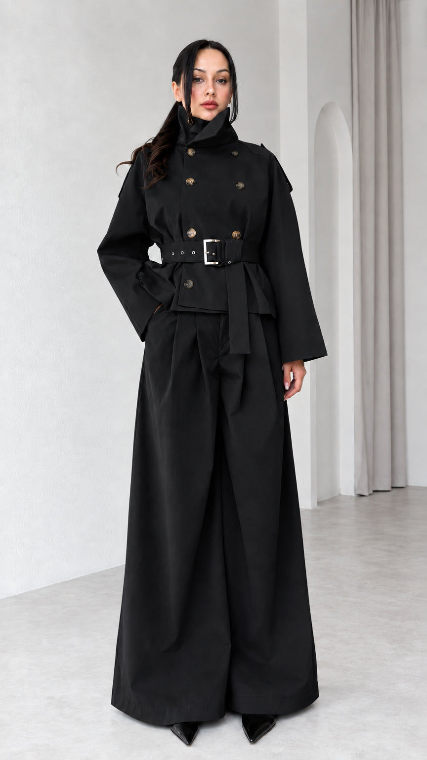 Model wearing Black double-breasted cropped trench jacket and matching wide-leg trousers