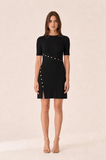 Front view of woman wearing black ribbed knit mini dress