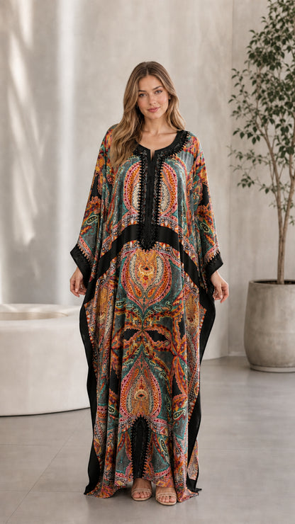 Front view of model wearing Black paisley print embroidered kaftan dress