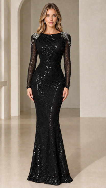 Model wearing black long sleeve sequin mermaid gown with beaded shoulder accents