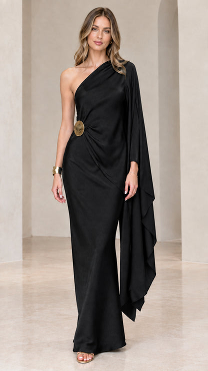 Black one-shoulder draped satin evening maxi dress with metallic waist brooch