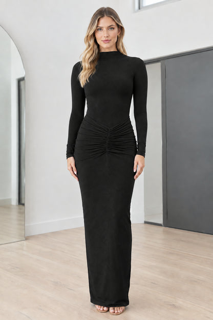 Full front view of model wearing Black mock neck long sleeve ruched maxi dress