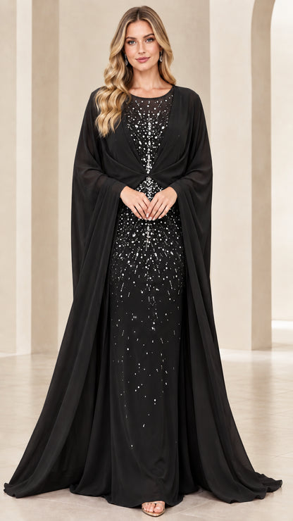 Model wearing black embellished cape evening gown