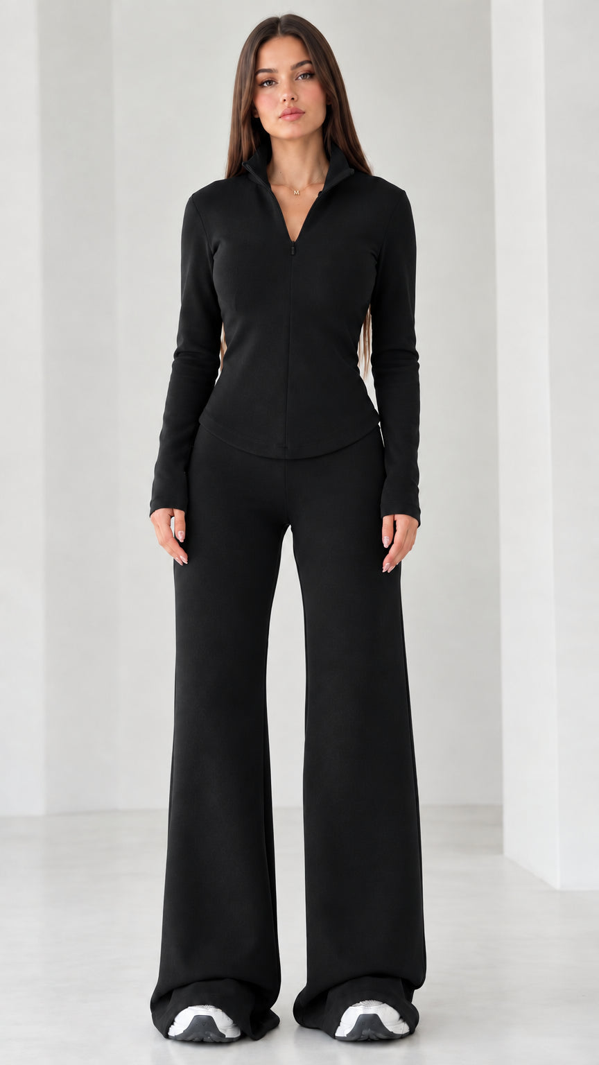 Women's black quarter-zip long sleeve top and matching wide-leg pants set
