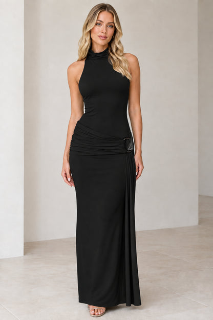 Model wearing black high-neck sleeveless ruched maxi dress with ring accent