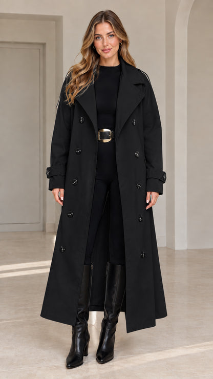 Front view of woman wearing black maxi double-breasted belted trench coat
