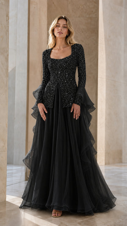 Black beaded long sleeve formal gown with cascading ruffle skirt
