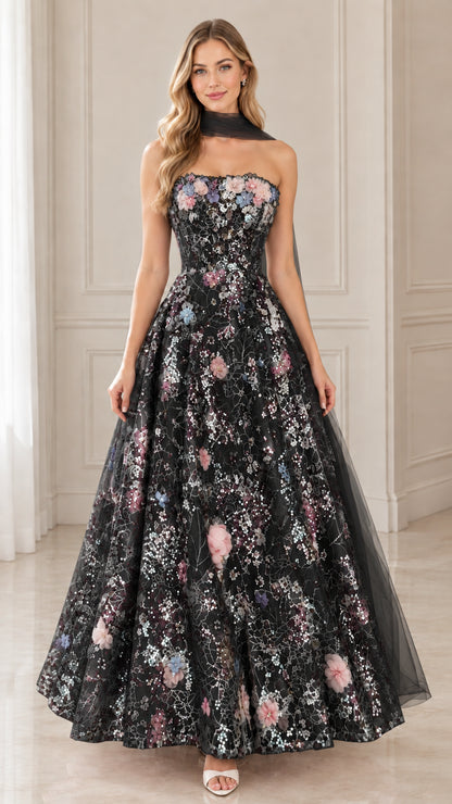 Model wearing black floral embroidered sequin strapless evening gown