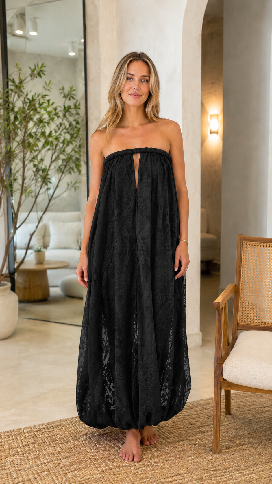 Front view of black strapless textured maxi dress with keyhole front and bubble hem